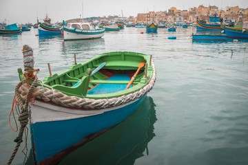 Fototapeta na wymiar Traditional colorful fishing boats in Malta, mediterranean island
