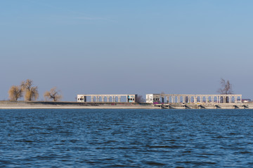 Beautiful Columns and Dark Blue Water on a Sunny Winter Day
