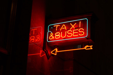 Neon taxi & buses sign