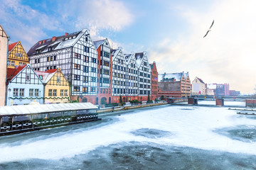 Fototapeta na wymiar Granery Island in Gdansk, winter view from the Motlawa river, Poland
