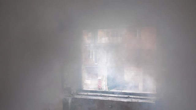Fire in a residential building. Smoke and fire in a residential apartment. Smoke fills the building. Fire in a residential building