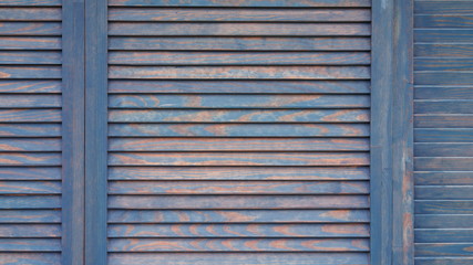 Wooden slat shutters, wooden background
