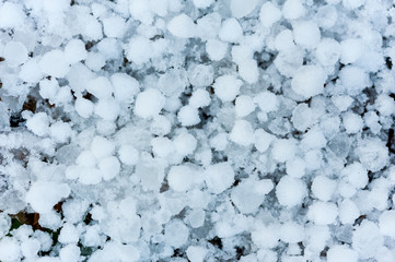 Close up of hail stones on the ground