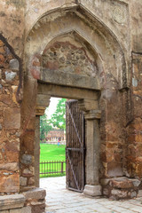 Fototapeta na wymiar Ancient stone wall and opened entrance 
