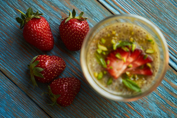 Fresh passion fruit cocktail with strawberries, close-up