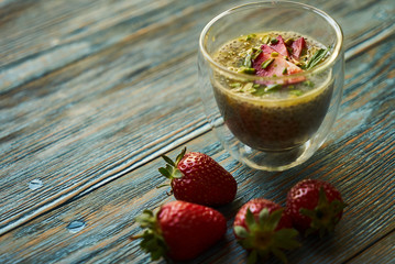 Fresh passion fruit cocktail with strawberries, close-up