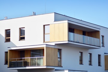 Modern apartment buildings on a sunny day with a blue sky. Facade of a modern apartment building