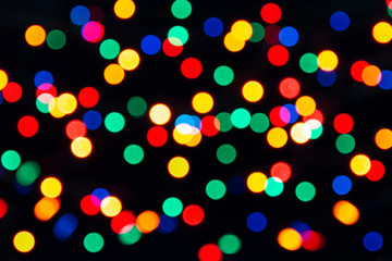 Naklejka premium Bokeh Lights On a Black Background