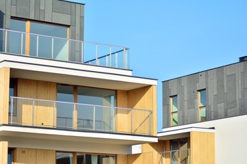 Modern apartment buildings on a sunny day with a blue sky. Facade of a modern apartment building