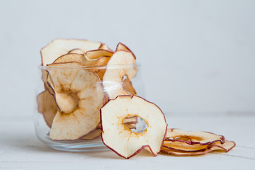 apple chips.Healthy snack.Healthy snack. Tasty dried apple and pear rings chips on light background 