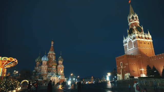 Red Square, Kremlin Clock, Kremlin wall and Saint Basil's Cathedral, traditional fair, winter, evening, holiday illumination, panorama