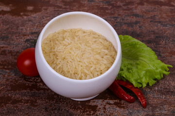 Raw uncooked rice in the bowl