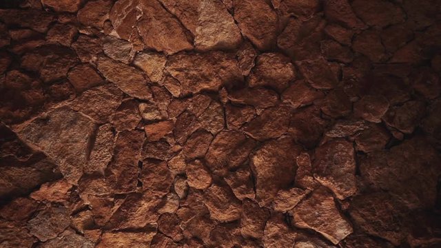 Close-up view of stones in wall or ceiling of grotto, moving shot