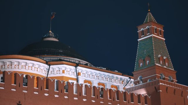 Russian flag and Kremlin wall. Red Squere, Moscow, Russia. No people, night, dark sky