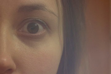 woman's eye close up, fear, victim