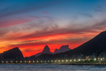 Night View of Copacabana Beach With Beautiful Red Sky Just After the Sunset, and Mountains in the...
