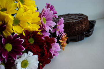 bright spring bouquet of flowers with cake