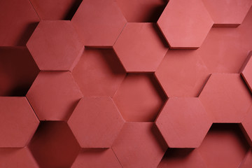 wall background. background texture. wall with textured hexagons. the diamonds on the wall. red wall