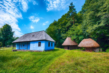 View of traditional romanian peasant houses in Transylvania, Romania.