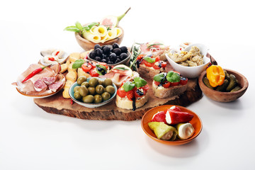 Italian antipasti wine snacks set. Cheese variety, Mediterranean olives, pickles, Prosciutto di...