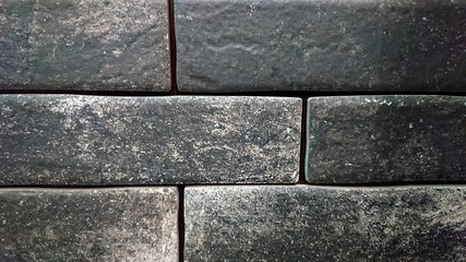 The abstract background of a old gray wall. Selective focus.