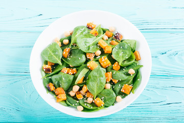 autumn salad with pumpkin , spinach , chickpea and sesame
