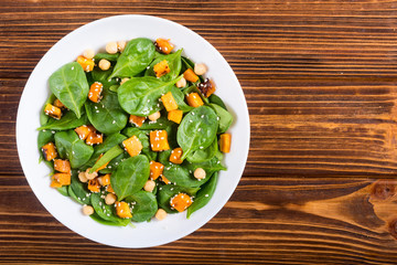 autumn salad with pumpkin , spinach , chickpea and sesame