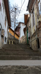narrow old pedestrian street of Veliko Tarnovo in Bulgaria with old houses and stairs