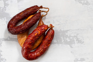 portuguese smoked sausages on ceramic background