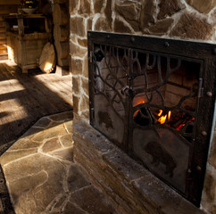 country style interior in hunter chalet with fireplace