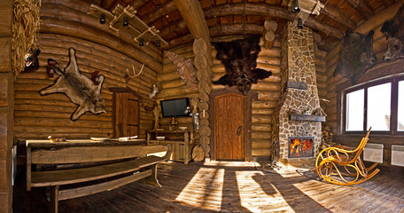 country style interior in hunter chalet with fireplace