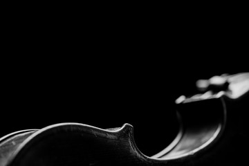 Side wooden parts retro violin on a black background