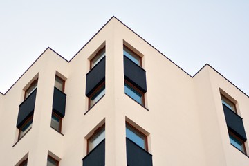 Modern apartment buildings on a sunny day with a blue sky. Facade of a modern apartment building