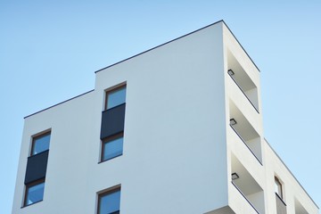 Modern apartment buildings on a sunny day with a blue sky. Facade of a modern apartment building