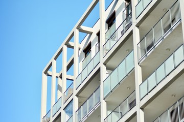 Modern apartment buildings on a sunny day with a blue sky. Facade of a modern apartment building