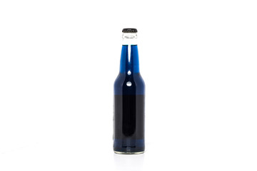 Soda bottle filled with blue liquid on plain white background