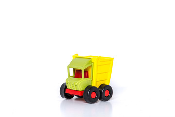 Angle view of colorful green and yellow dump truck