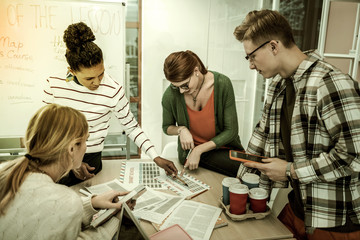 Four students feeling inspired while participating in charity project