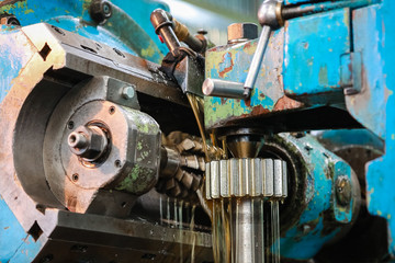Obraz na płótnie Canvas Processing of metal detail on the old machine.
