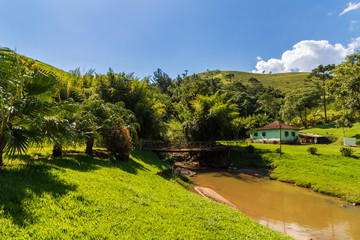 view of a river in the mountains to sunset