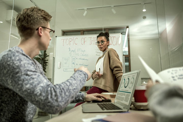 Blonde student identifying some issues speaking with teacher