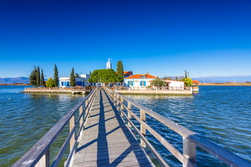 Naklejka premium Saint Nicholas Monastery located on two islands in Porto Lagos, East Macedonia and Thrace, Greece