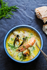 Scandinavian creamy fish soup with halibut, prawns and mussels