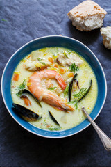 Scandinavian creamy fish soup with halibut, prawns and mussels