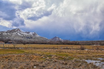 inter Panorama of Oquirrh Mountain range snow capped, which includes The Bingham Canyon Mine or Kennecott Copper Mine, rumored the largest open pit copper mine in the world in Salt Lake Valley, Utah. 
