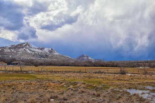 inter Panorama of Oquirrh Mountain range snow capped, which includes The Bingham Canyon Mine or Kennecott Copper Mine, rumored the largest open pit copper mine in the world in Salt Lake Valley, Utah.