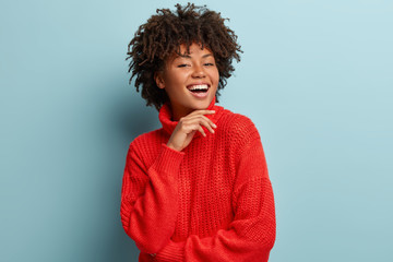 Glad proud self confident cheerful woman has no makeup, demonstrates natural beauty, holds hand...