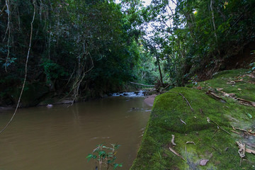 view of a river in the mountains to sunset