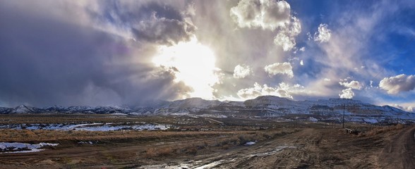 inter Panorama of Oquirrh Mountain range snow capped, which includes The Bingham Canyon Mine or Kennecott Copper Mine, rumored the largest open pit copper mine in the world in Salt Lake Valley, Utah. 