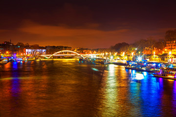 Seine River and bridge at night in Paris 